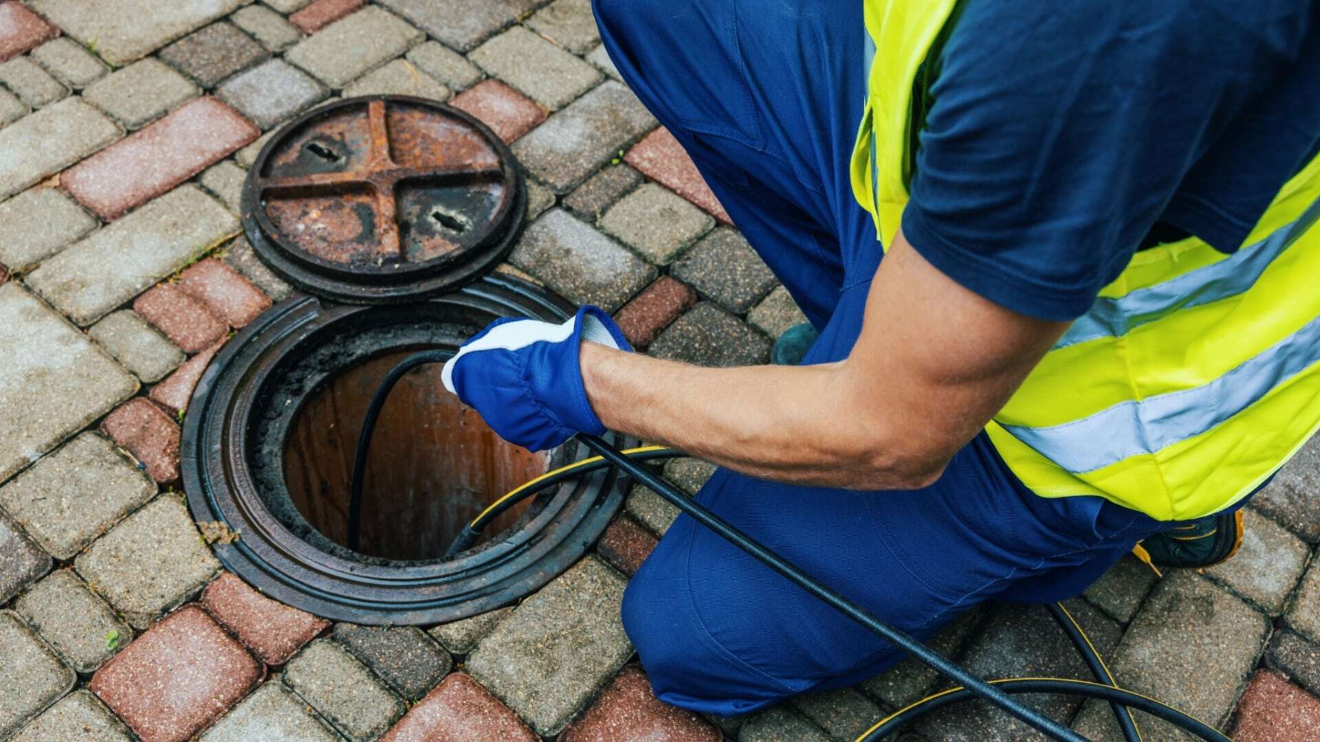Bison Plumbing technician performing a sewer camera inspection in a Macomb County home