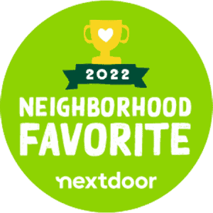 Green circular badge with a yellow trophy and heart icon, text reads 2022 Neighborhood Favorite above the Nextdoor logo, signifying an award or recognition.