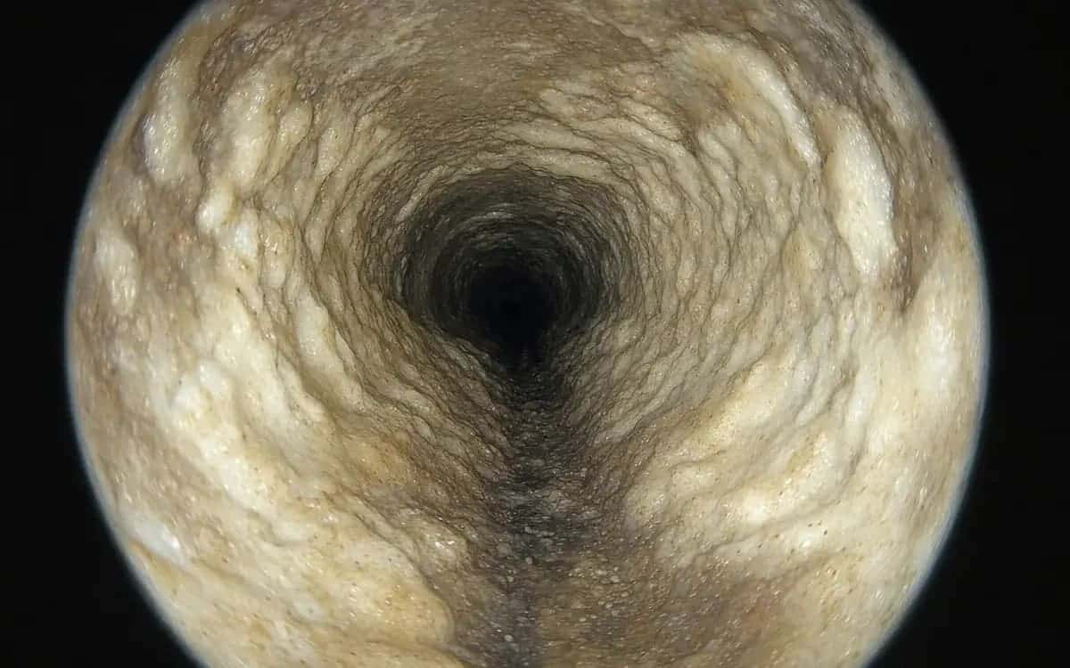 Cast-iron kitchen drain line with 60% scale buildup — Warren, MI home built 1964