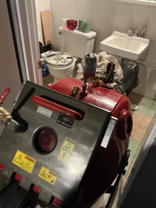 CIPP curing equipment set up at the interior access point for trenchless sewer line repair in Sterling Heights, MI